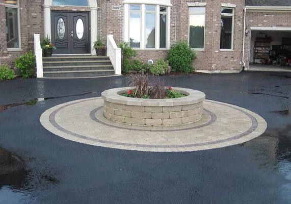Driveway-with-brick-inlay-and-brick-planter